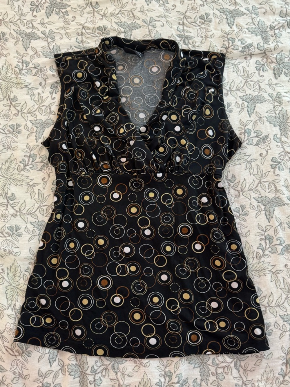 Sleeveless Black Top with Circular Print and wrap detail